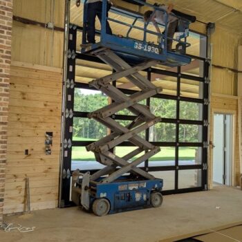 technicians working on a door repair
